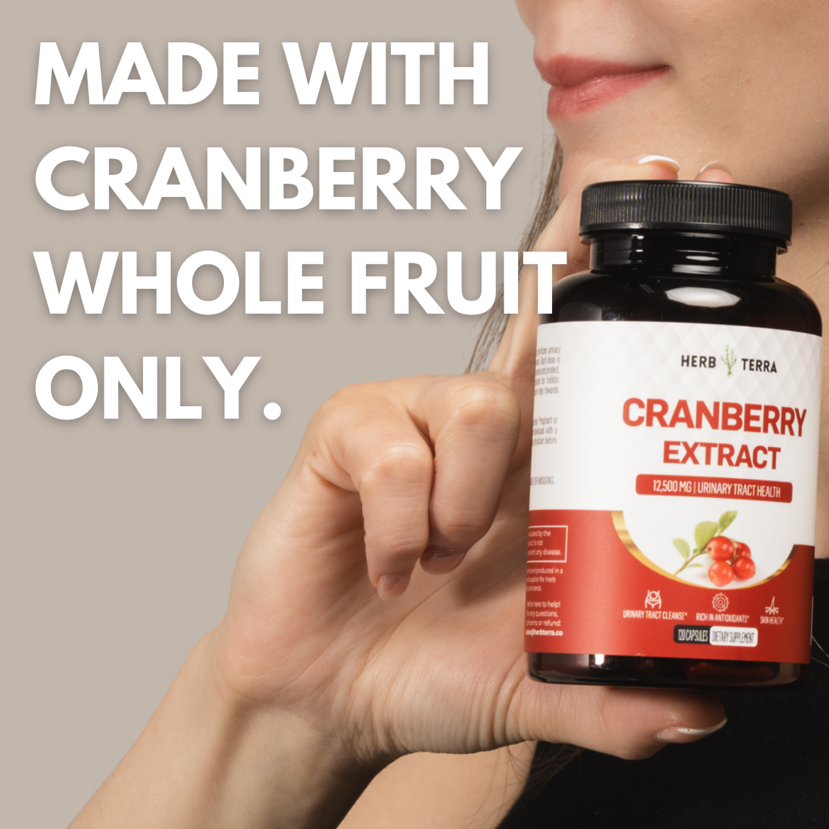 Hand holding Cranberry Extract bottle | Herb Terra